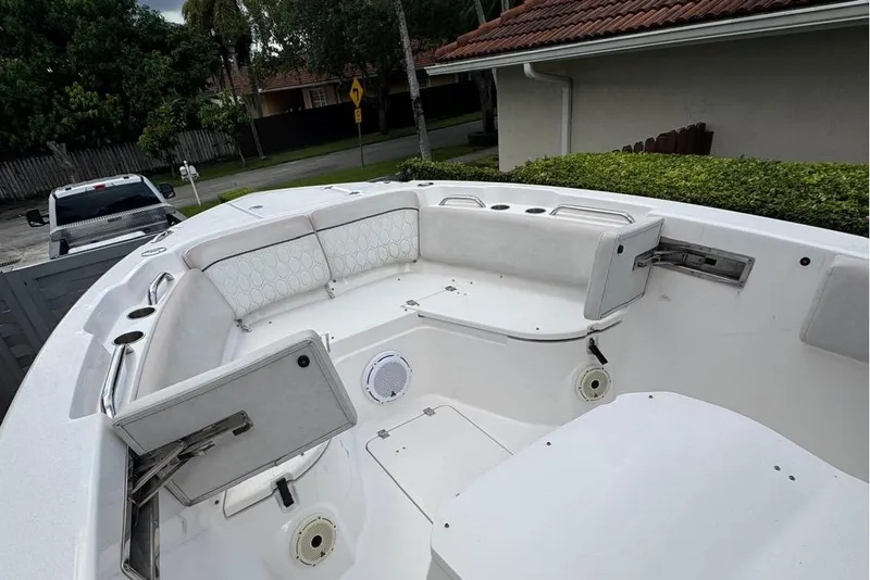 Slide: The Image of 2021 Sea Fox 268 Commander boat interior with white seating and storage compartments. - 10