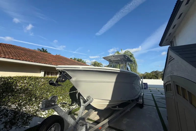 Slide: The Image of 2021 Sea Fox 268 Commander boat on trailer in residential driveway. - 16