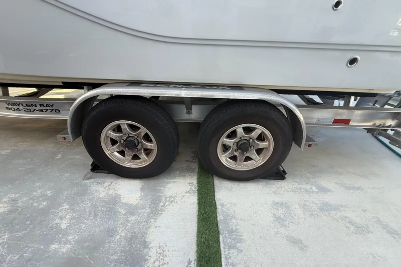 Slide: The Image of Trailer wheels of a 2021 Sea Fox 268 Commander boat on concrete. - 25