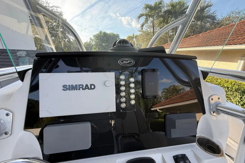 Slide: The Image of 2021 Sea Fox 268 Commander dashboard with Simrad and JL Audio equipment. - 34