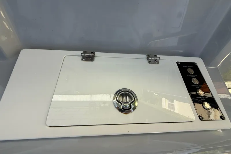 Slide: The Image of Control panel on 2021 Sea Fox 268 Commander boat, featuring buttons and a latch. - 36
