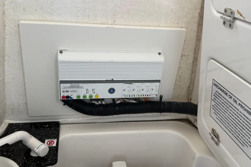 Slide: The Image of Electrical panel in 2021 Sea Fox 268 Commander boat, featuring control switches and wiring. - 39