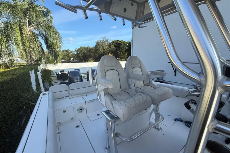 Slide: The Image of 2021 Sea Fox 268 Commander boat interior with dual cushioned seats and stainless steel fixtures. - 49