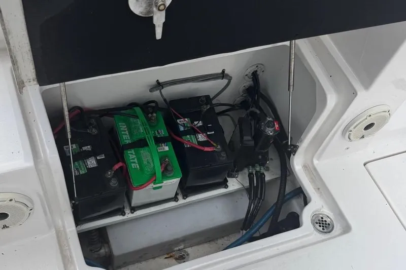 Slide: The Image of Battery compartment of 2021 Sea Fox 268 Commander boat, showing multiple batteries and wiring. - 5