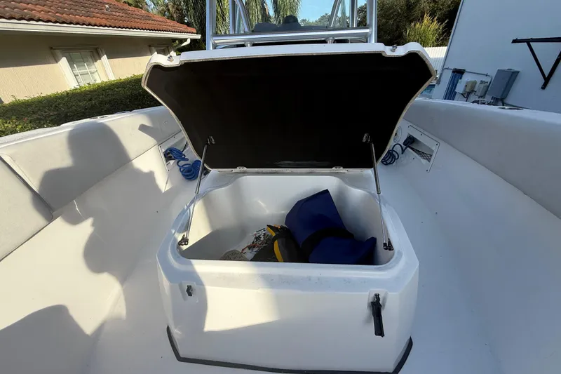 Slide: The Image of 2021 Sea Fox 268 Commander boat storage compartment open with gear inside. - 52