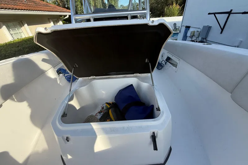 Slide: The Image of Open storage compartment on 2021 Sea Fox 268 Commander boat with gear inside. - 53