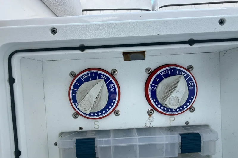 Slide: The Image of Battery switches on a 2021 Sea Fox 268 Commander boat control panel. - 54
