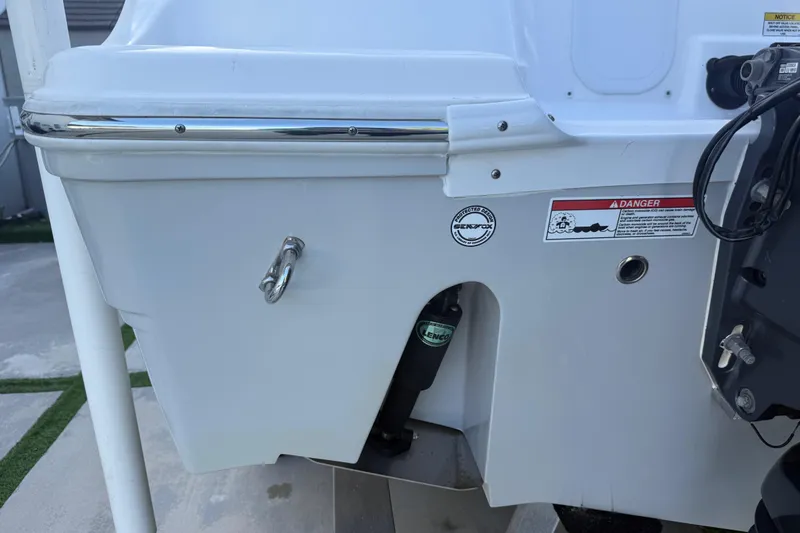 Slide: The Image of 2021 Sea Fox 268 Commander boat stern with warning labels and hardware. - 58