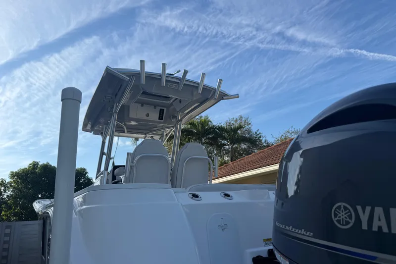 Slide: The Image of 2021 Sea Fox 268 Commander boat with Yamaha engine under a clear blue sky. - 61