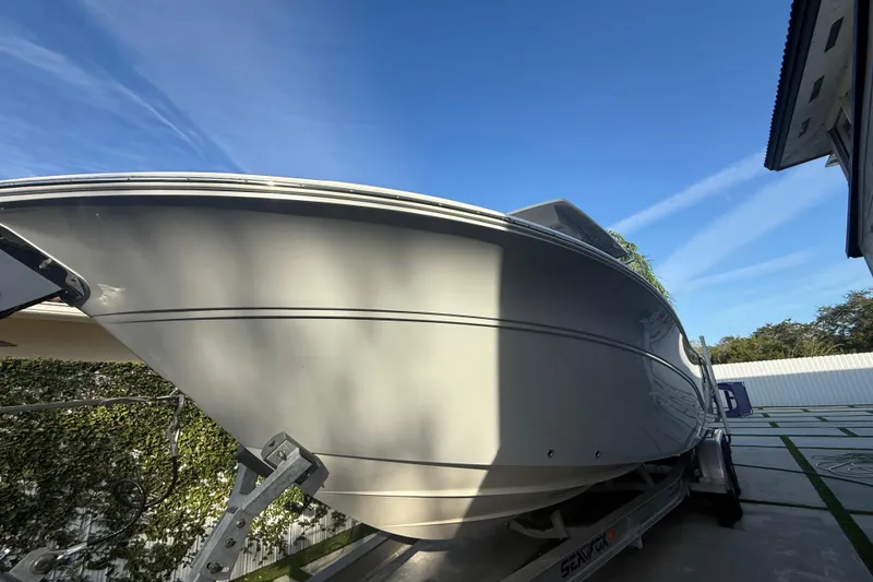 Slide: The Image of 2021 Sea Fox 268 Commander boat on trailer under clear blue sky. - 62