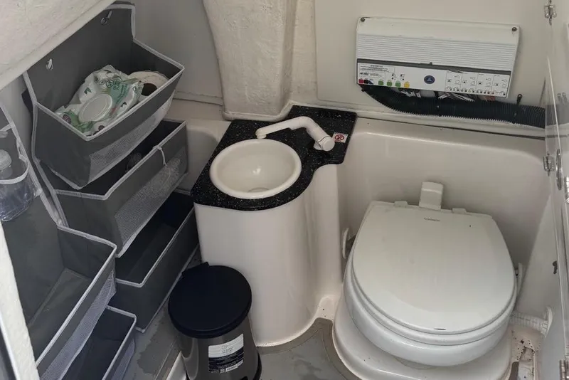 Slide: The Image of Interior of 2021 Sea Fox 268 Commander boat with toilet, sink, and storage compartments. - 7
