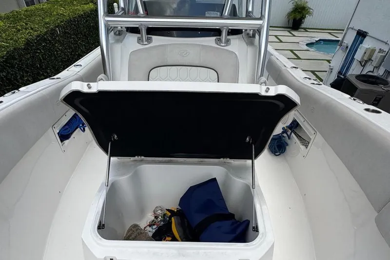 Slide: The Image of 2021 Sea Fox 268 Commander boat with open storage compartment, showcasing interior space. - 9