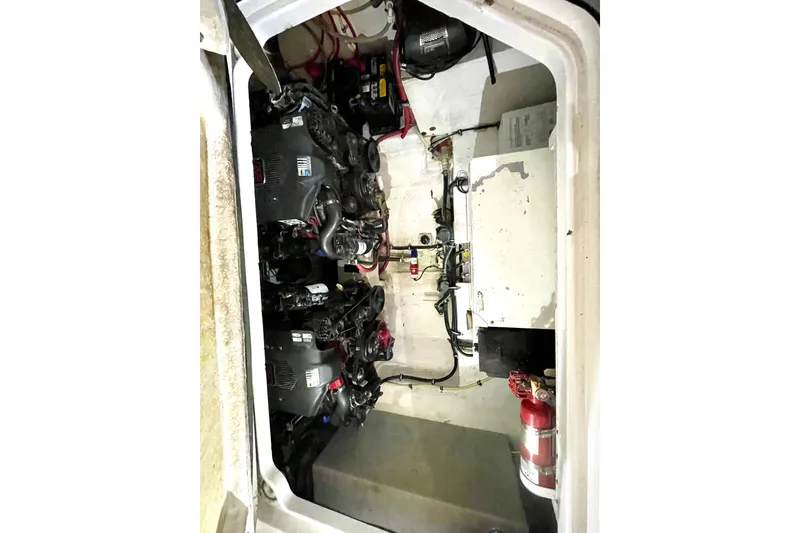 Slide: The Image of Engine compartment of a 2005 Chaparral 270 Signature boat, showing mechanical components. - 26