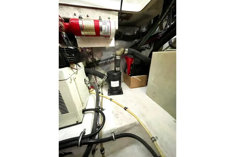 Slide: The Image of Engine compartment of 2005 Chaparral 270 Signature with fire extinguisher and hoses. - 28