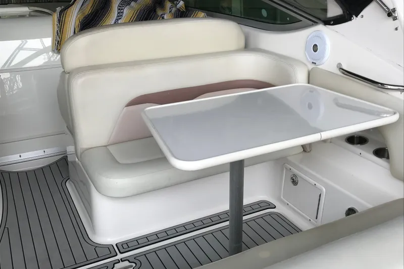Slide: The Image of 2005 Chaparral 270 Signature boat interior with seating and table setup. - 5