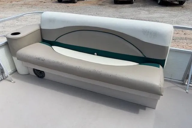 Slide: The Image of Grumman 24 FS 1997 boat seat with cup holder, beige and green upholstery. - 15