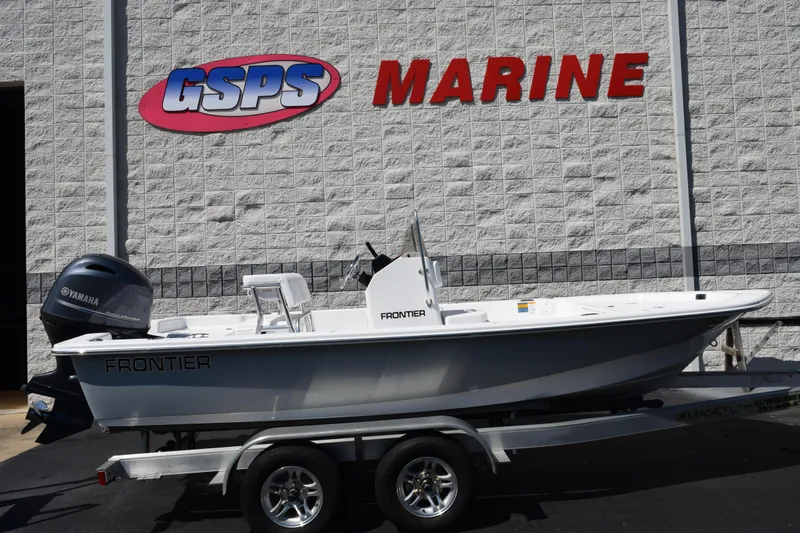 The Image of 2026 Frontier 180 boat on trailer at GSPS Marine dealership. - 1