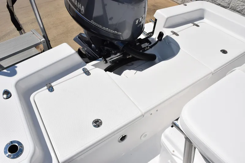 Slide: The Image of 2026 Frontier 180 boat with Yamaha engine, featuring white deck and storage compartments. - 10