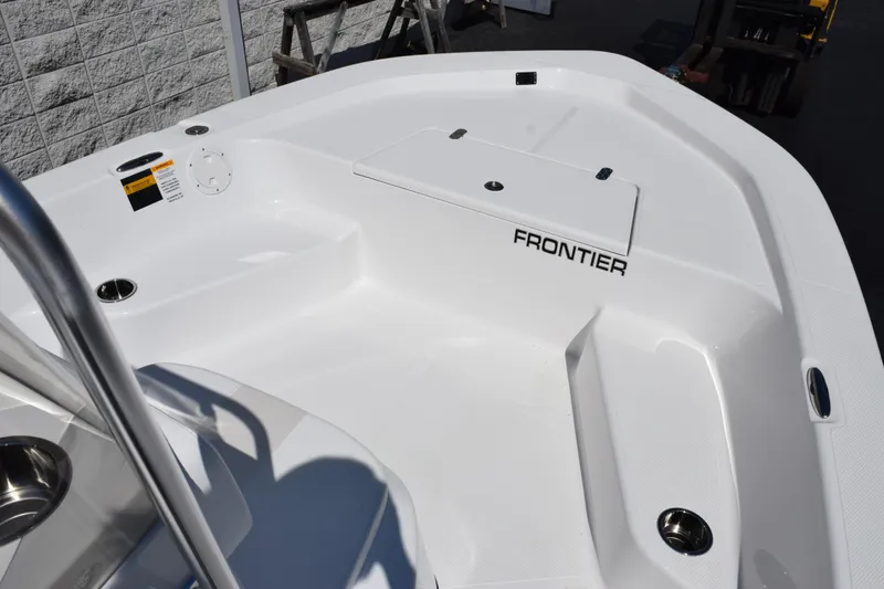 Slide: The Image of 2026 Frontier 180 boat interior with sleek white design and modern features. - 11