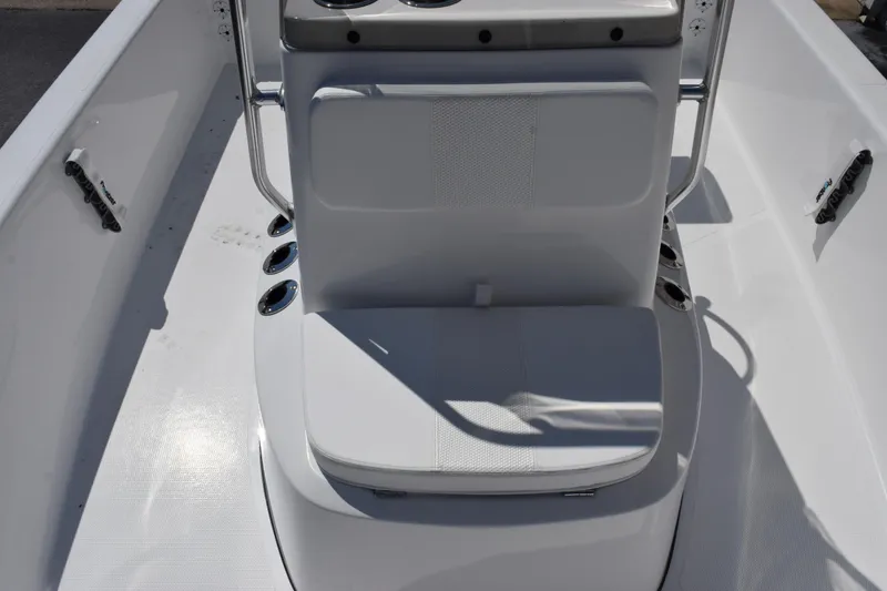 Slide: The Image of 2026 Frontier 180 boat interior with white seating and cup holders. - 12