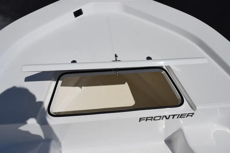 Slide: The Image of 2026 Frontier 180 boat storage compartment with open hatch, showcasing sleek design. - 13