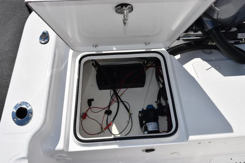 Slide: The Image of Open hatch of 2026 Frontier 180 boat showing wiring and components. - 17