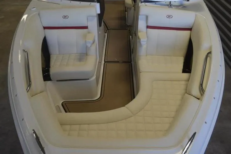 Slide: The Image of 2018 Cobalt R5 Surf boat interior with white leather seating and red accents. - 9