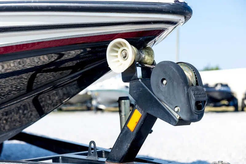 Slide: The Image of Close-up of 2011 Triton 20XS DC boat trailer winch and bow support. - 10