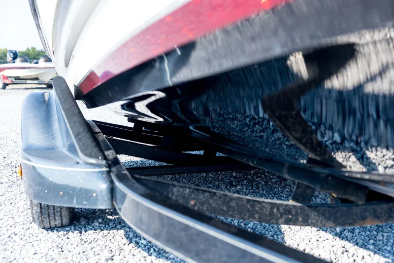 Slide: The Image of 2011 Triton 20XS DC boat on trailer, close-up view of hull and trailer frame. - 11