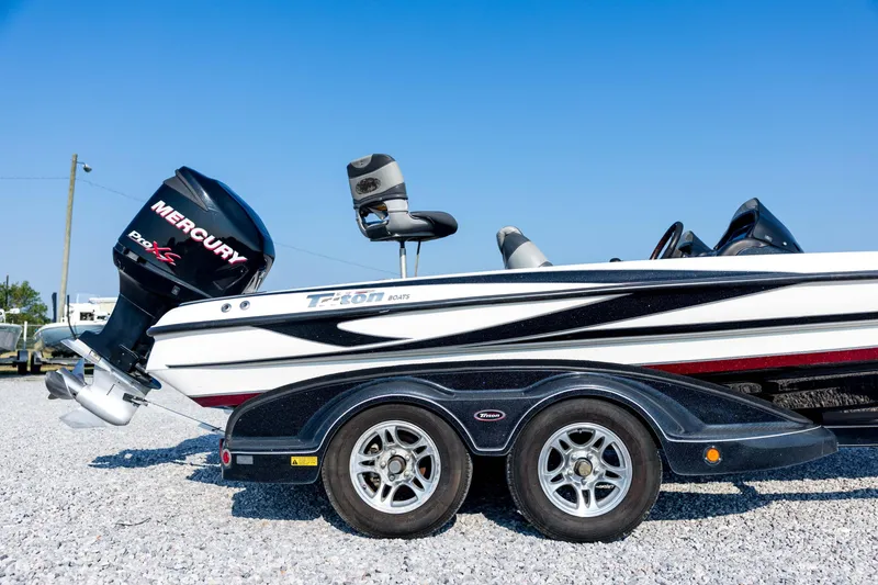 Slide: The Image of 2011 Triton 20XS DC boat with Mercury Pro XS engine on a trailer. - 12