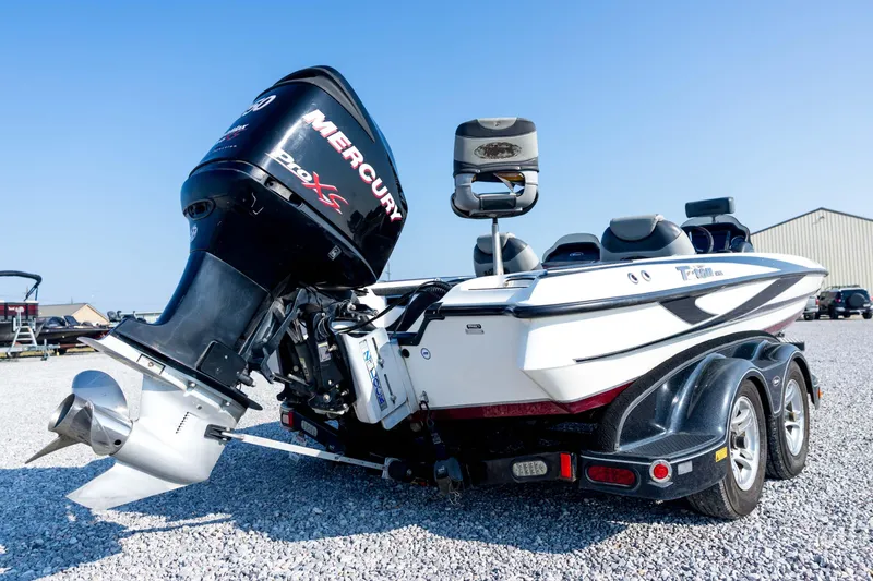 Slide: The Image of 2011 Triton 20XS DC boat with Mercury Pro XS engine on gravel lot. - 15