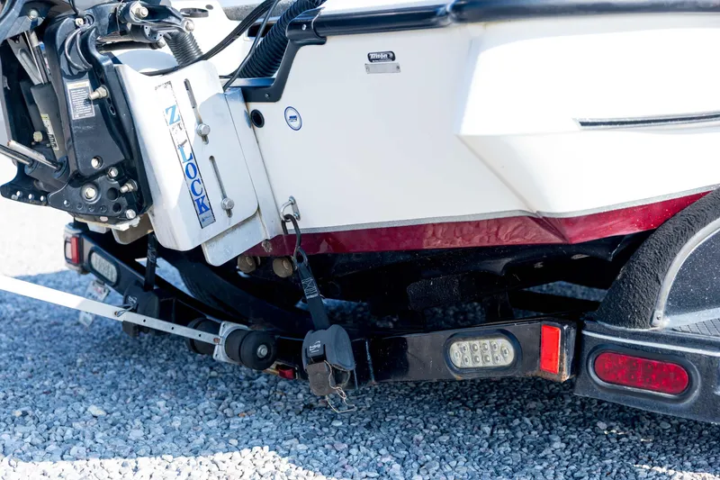Slide: The Image of Rear view of a 2011 Triton 20XS DC boat on a trailer, showing motor and Z-Lock system. - 16
