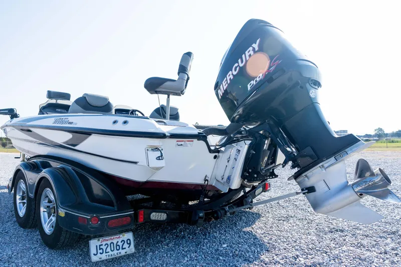 Slide: The Image of 2011 Triton 20XS DC boat with Mercury Pro XS engine on a trailer. - 19