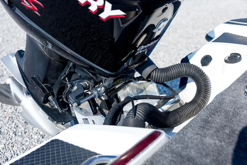 Slide: The Image of 2011 Triton 20XS DC boat engine detail with Mercury branding. - 23