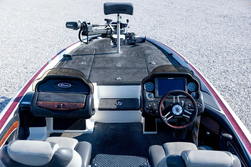 Slide: The Image of 2011 Triton 20XS DC boat interior with steering wheel and control panel. - 35