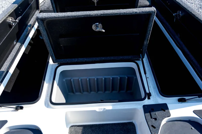 Slide: The Image of 2011 Triton 20XS DC boat storage compartments with open lids. - 43