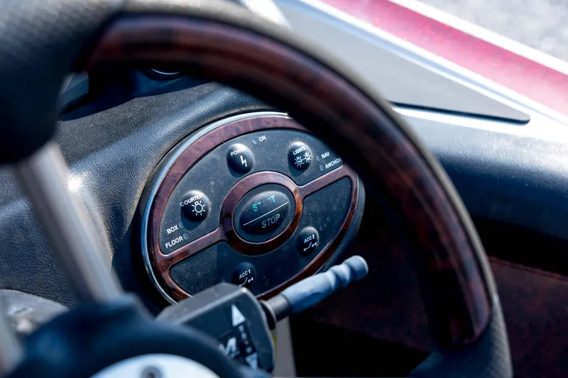 Slide: The Image of Steering wheel and control panel of 2011 Triton 20XS DC boat. - 53