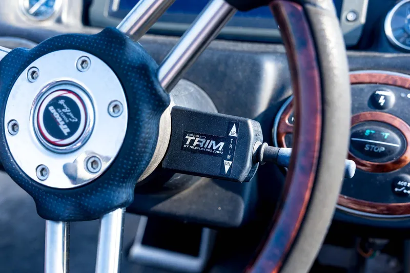 Slide: The Image of Steering wheel of 2011 Triton 20XS DC boat with Pro Trim control. - 54