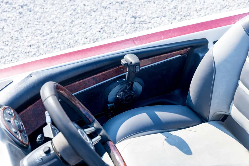Slide: The Image of 2011 Triton 20XS DC boat interior with steering wheel and throttle control. - 61