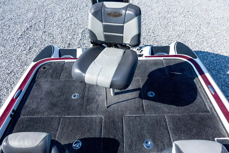 Slide: The Image of 2011 Triton 20XS DC boat interior with gray seating and carpeted deck. - 64