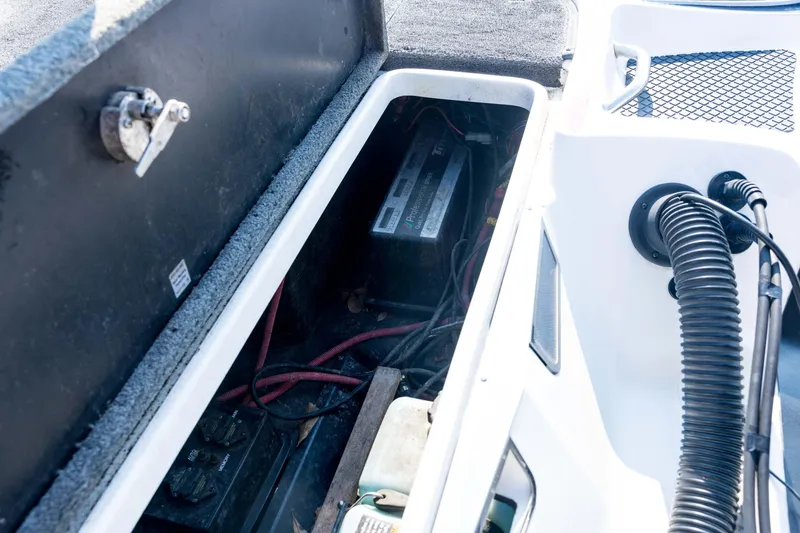 Slide: The Image of 2011 Triton 20XS DC boat battery compartment with wiring and components. - 72