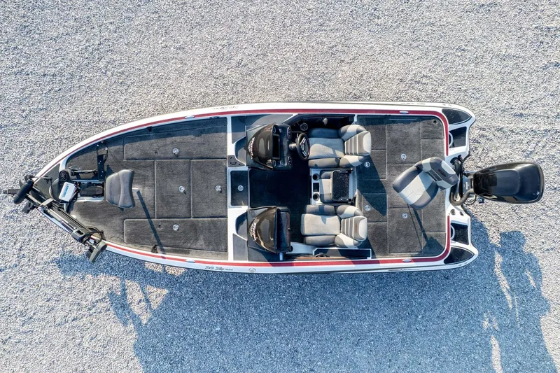 Slide: The Image of Overhead view of 2011 Triton 20XS DC boat on gravel surface. - 74