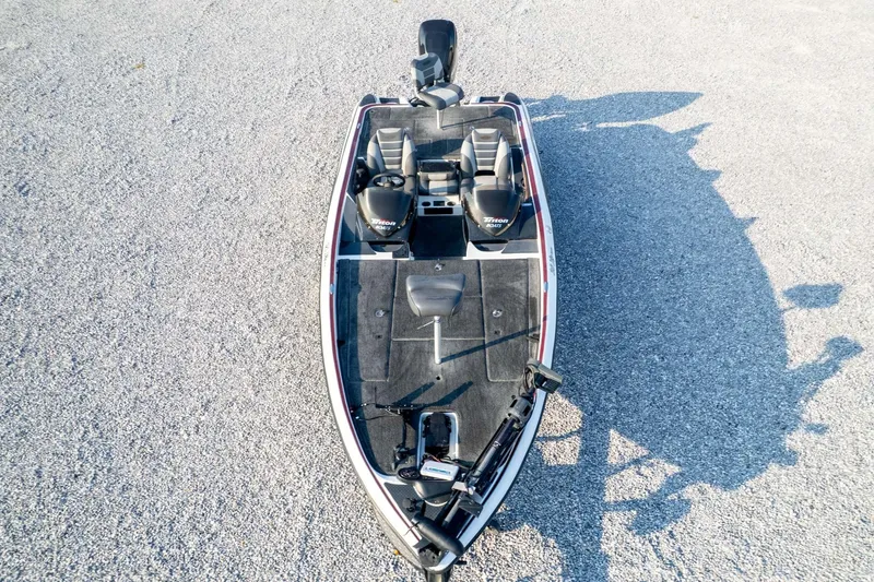 Slide: The Image of 2011 Triton 20XS DC boat, aerial view on gravel surface. - 79