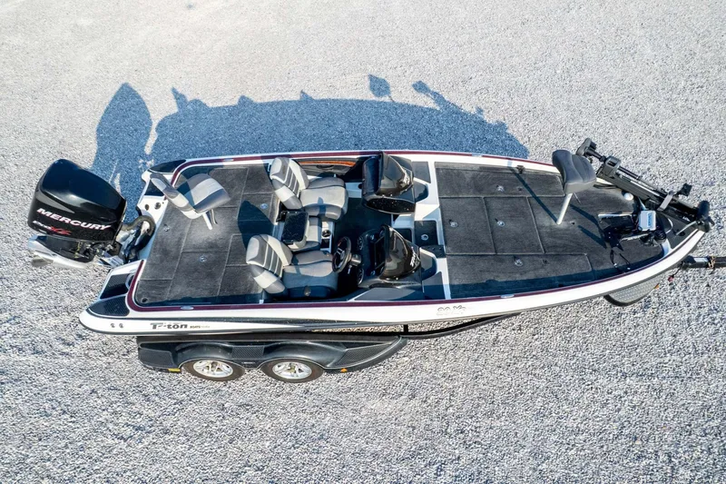 Slide: The Image of 2011 Triton 20XS DC boat with Mercury engine, aerial view on gravel surface. - 81