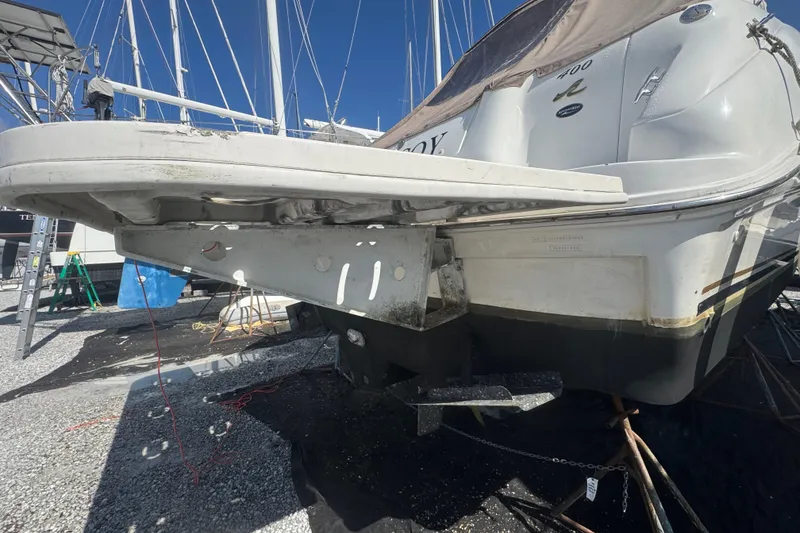 Slide: The Image of 1999 Sea Ray Sundancer 400 yacht on dry dock, showing rear view and swim platform. - 14