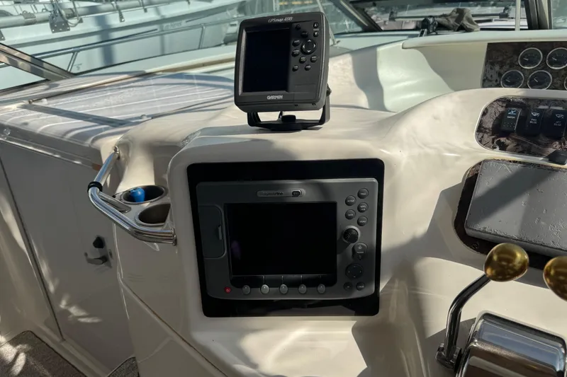 Slide: The Image of 1999 Sea Ray Sundancer 400 helm with Garmin GPS and control panel. - 4
