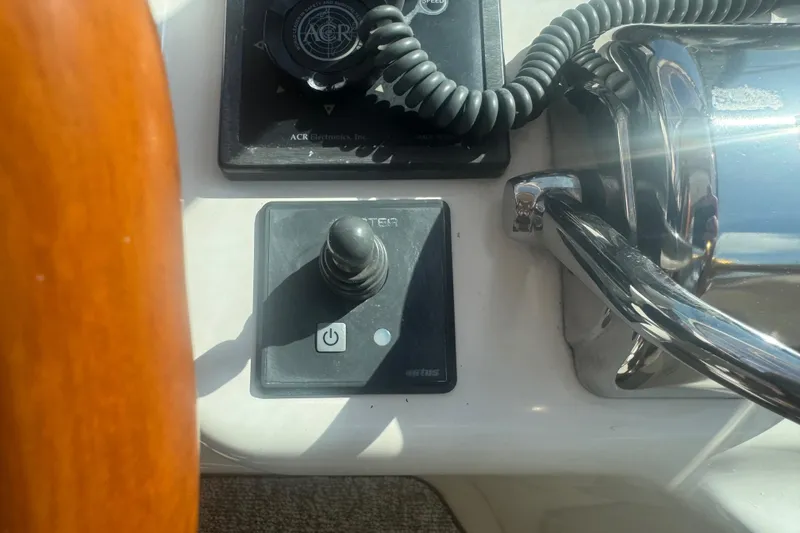 Slide: The Image of Control panel of a 1999 Sea Ray Sundancer 400 boat with joystick and electronics. - 6