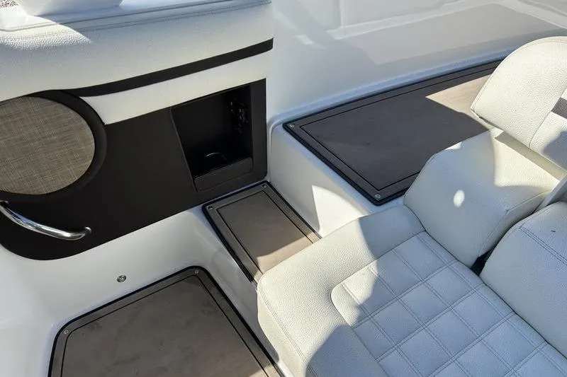 The Image of 2017 Cobalt R30 boat interior with white seating and storage compartments. - 0
