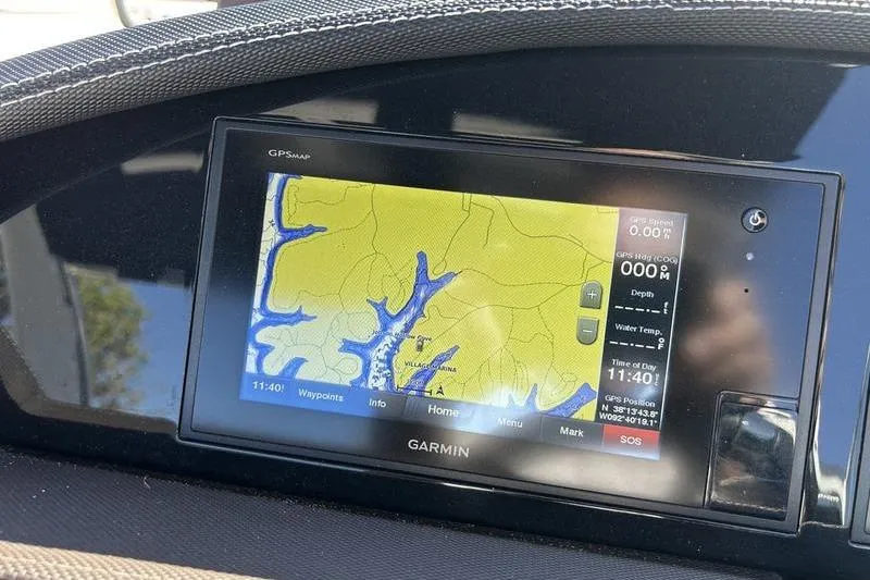 Slide: The Image of Garmin GPS display on 2017 Cobalt R30 boat dashboard showing navigation map. - 13