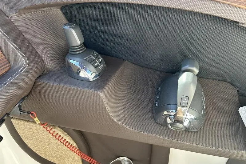 Slide: The Image of 2017 Cobalt R30 boat controls with joystick and throttle levers. - 4